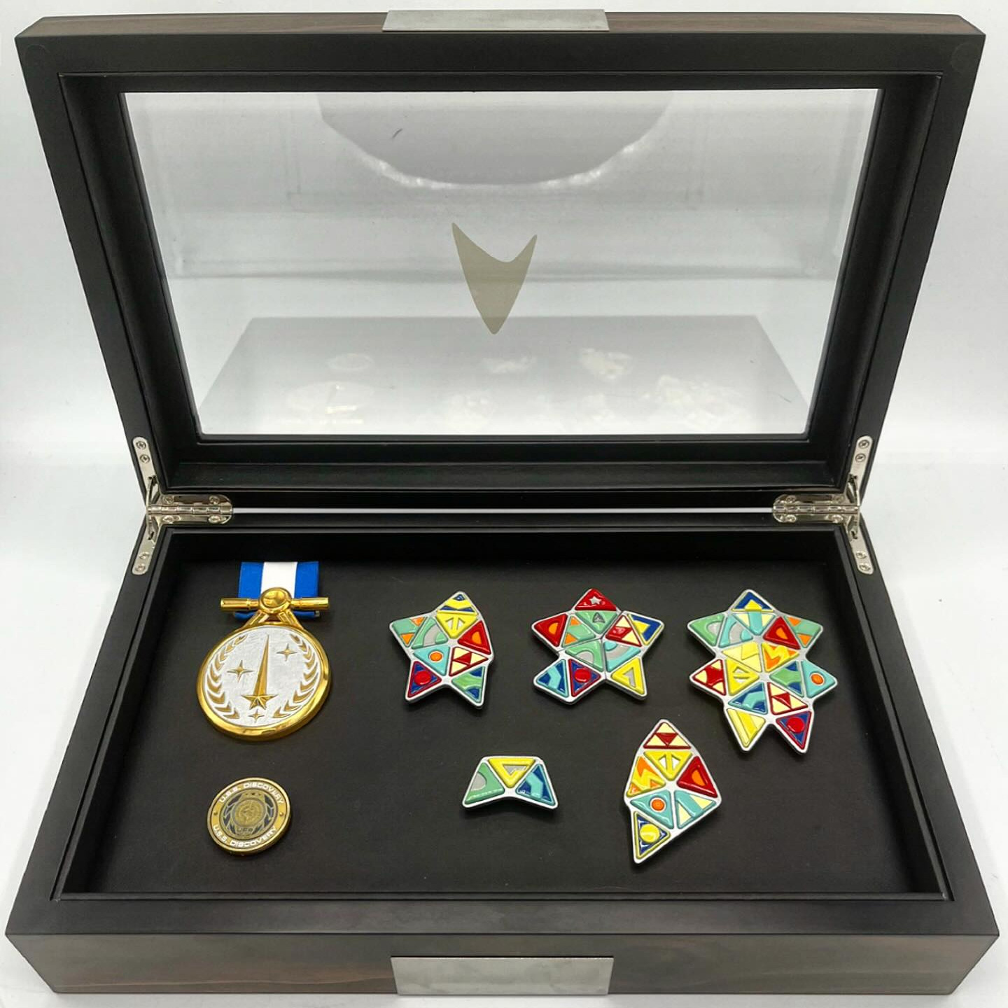 Display case containing triangular awards